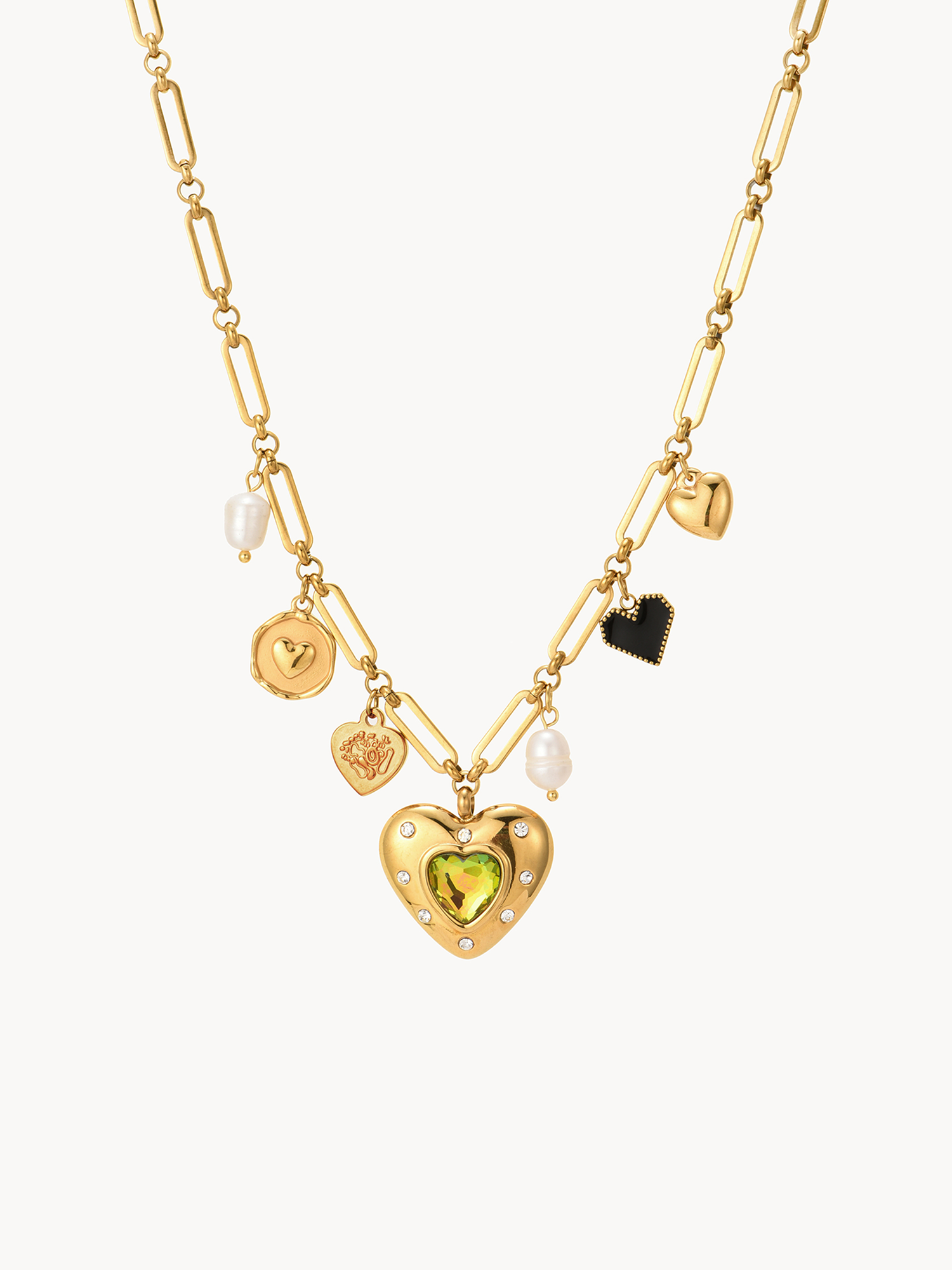 Gold necklace with heart-shaped pendant and various charms